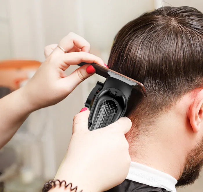 A man getting a haircut with the clipper